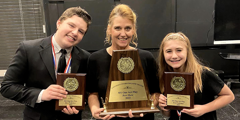Jax Woods, Louise Hickey, and Sophia Johnson hold trophies earned at the UIL 5A Junior High One-Act Play contest on Feb. 4, 2023