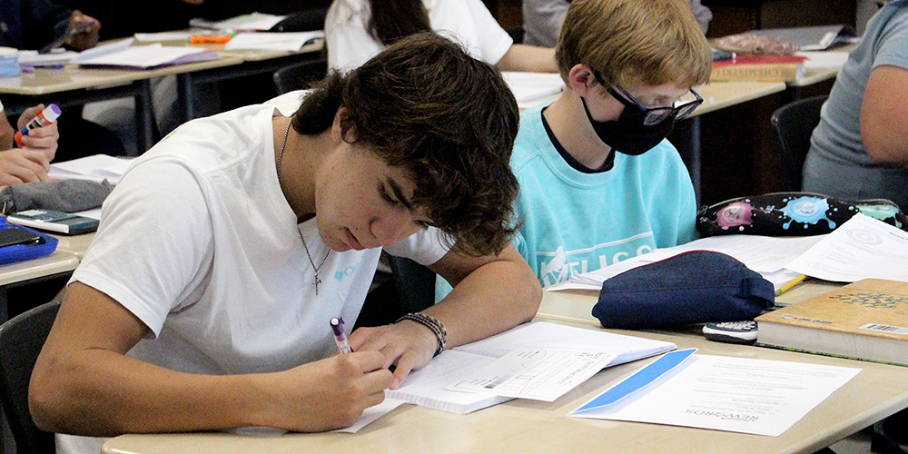 high school students work on an assignment in class