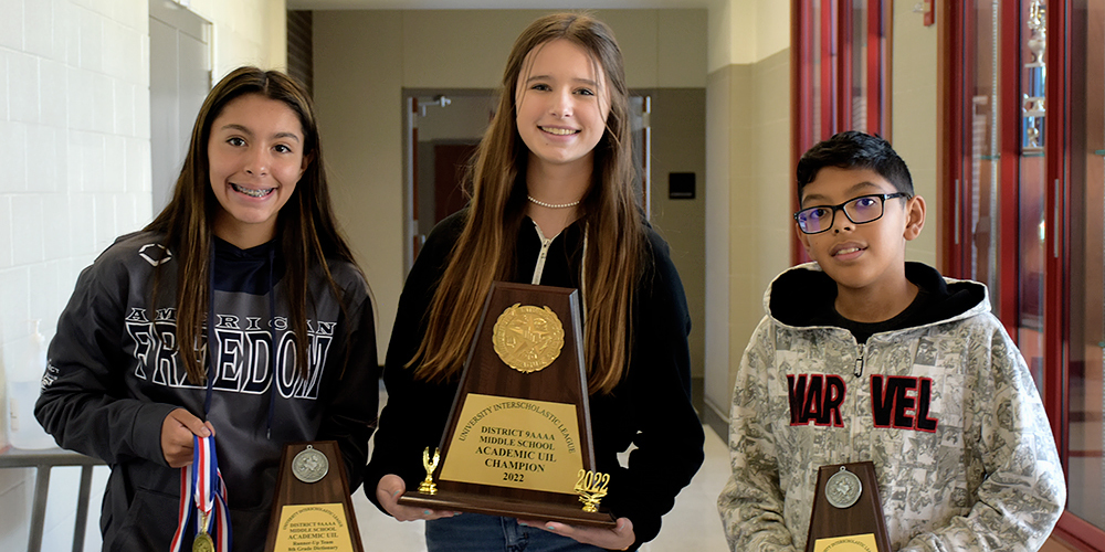 Three Melissa Middle School students with the 2022 UIL A+ Academics Trophy