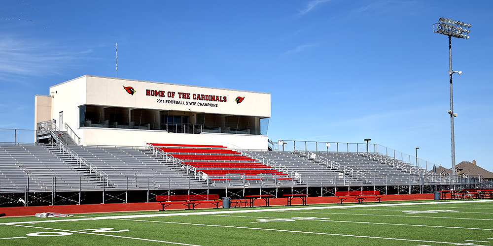 a photo of Cardinal Stadium that shows part of the field, home bleachers, and the press box