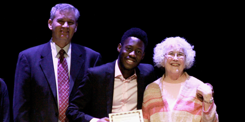 A student receives an award at the MEF senior scholarship night