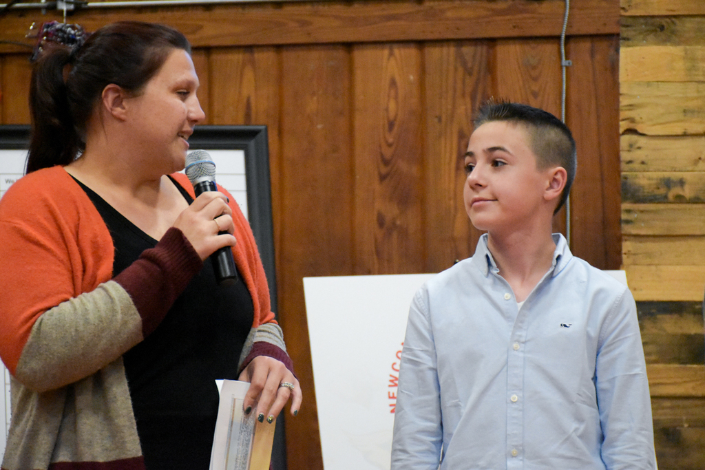 North Creek Elementary student listens as his teacher shares why he is receiving a Cardinal Commendation